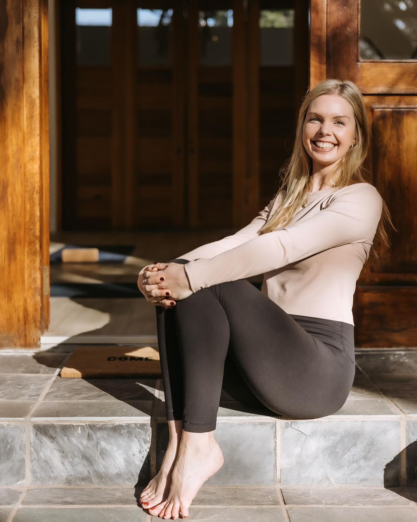 Beneath Parkview’s jacarandas and tucked behind a creeper-covered stone wall you’ll find the @joyful_yogi yoga studio, a sanctuary as joy-filled as its owner.
As I arrive, the doors stand open with the sounds of summer, city life, and her little boy’s laughter drifting through on the breeze. I’m met on the steps in the sunshine by Katey, her familiar warmth and grace are comfort to me on a busy day. I’m convinced that you will not find a brighter smile or a soul more beautiful than hers.
As I roll out my mat I think about how grateful I am: mostly in this moment I feel grateful for the way yoga has connected us, and the depth it gives to our friendship. I think of how much we share : our love of the practice, epic playlists, synchronised flows, our journeys as small business owners, and both being hustling moms. What we do not share is technological ability (I owe my beautiful website and recently acquired digital literacy to her by the way). Without Katey I would still be hiding behind 10-tab excel spreadsheets and awkward emails trying to sell in-studio yoga classes to people who left Jozi 5 years ago.
The warmth in this beautiful little home studio is something you need to experience firsthand. If you’re in/around the Parkview area, pop in to @joyful_yogi studio corner Kilkenny and Tyrone Avenue. It is open and ready to welcome you to a space where peace and community flourish.
And watch this space, we have some exciting ideas in the pipeline and we can’t wait to share them with you…
P.S. Katey’s class ended with a dreamy savasana. So dreamy in fact that I forgot my bag at the studio and when I came back to fetch it, left my car outside without the hand break on, only to come out and watch it rolling away down the road. I stood wide-mouthed watching my car being “stolen” before realising there was no thief in the driver’s seat, so I took chase! If you’re looking for a sweet savasana, you’ll certainly find it here 😂 Next time maybe I’ll catch an Uber. 📷@shot_byashdowding