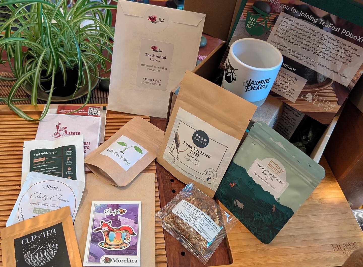 This past weekend we enjoyed tasting three of the teas from our TeaFestPDX Box in a virtual gathering, led by the tea vendors. We also learned about fundamental teaware with Being Tea. We’d like to thank all of the box contributors!
Our three Bronze Sponsors: Anna Ye Tea, Herbs & Kettles and Plum Deluxe
Our Inclusivity Sponsor: Being Tea
And our Box Contributors: Amu Nutrition, Cultivate Taste Tea, Cup of Tea, The Jasmine Pearl Tea Company, Kiara Naturals, Morelitea, Tea Infusiast