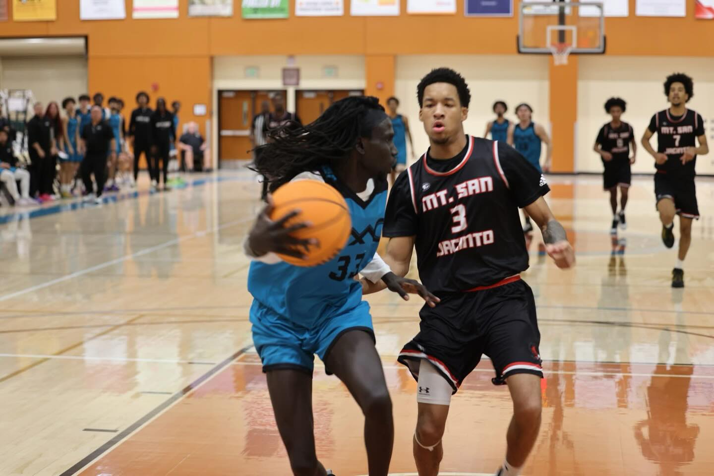 I’m not the world’s best sports photographer, and I don’t have the best equipment for it, but I’m really growing to like shooting sports here at the college. This photo is only significant in that in less than one second after I took it, player #33, Jefur Deng, a great guy on the Fighting Cacti - our team - came crashing into me as I was shooting from behind and below the basket. Lucky I was there, as it helped cushion him from hitting the wall that was directly behind me.
I spent the rest of the game with an ice pack on my left knee, feeling like I had a couple of bruised ribs, and of course, a bit of wounded pride, as I realized I’m not 22 anymore. Ouch! Not sure if this injured me more physically or to my poor, beat up male pride.
In any event, an ice pack and an ibuprofen and I’m good to go. I’m not dead yet. But I’m also not signing up for any football team either.