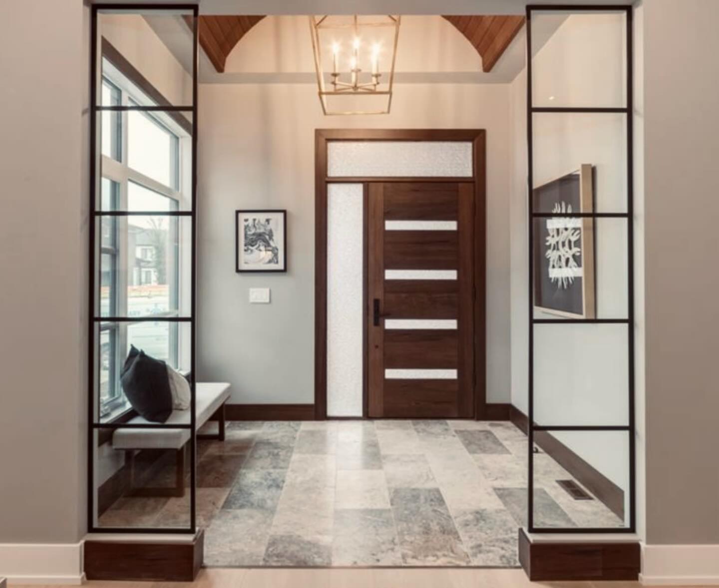 Foyer Elegance💛
This home renovation included an extension for a new foyer area. We were able to capitalize on high ceilings and adding natural light. We included a beautiful barrel vault, walnut plank, beautiful travertine floor tile, and stunning light fixture.
By pushing the foyer out, we were also able to increase the living room, stairwell, and front closet areas. Making this home feel like a custom estate bungalow.
#renovation #interiordesign #homedesign #customhomes #foyerdesign